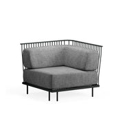 A modern Cannolè Lounge Corner Module with a black steel wire back, thick gray upholstered cushions, and minimalist design. Perfect for outdoor/indoor spaces, it features slender legs and clean lines, set against a plain white background.