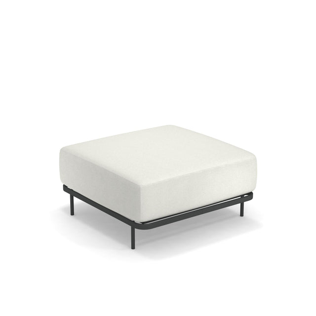 The Cannolè Lounge Ottoman features a minimalist, modern design with a thick white cushion atop a slim, black steel frame and four black legs. Suitable for outdoor/indoor use, it sits elegantly against a plain white background.