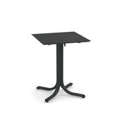 A square, black metal indoor/outdoor table with a flat top and a single central support branching into four curved legs with small feet. The simple, modern design is perfect for versatile spaces.
