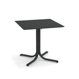 A modern, square, black solid surface table with a thin tabletop and a central pedestal base that splits into four curved legs. Minimalistic and sturdy, it suits both indoor/outdoor use and features a stylish matte finish.