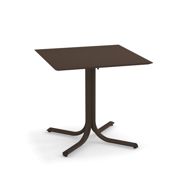 A brown, square indoor/outdoor table with a flat top and a central pedestal branching into four curved legs, each ending with a small foot. Minimalist in design, this solid surface table appears to be made of metal.