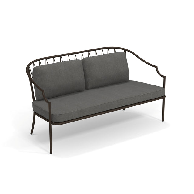 A modern Como Loveseat with a steel wire diamond pattern frame and curved armrests, featuring a minimalist, open design. The seat and two back cushions are upholstered in dark gray fabric, perfect for stylish indoor/outdoor use.