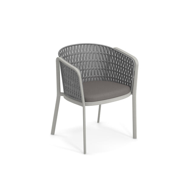 A modern gray Carousel Armchair with a rounded backrest and armrests featuring a woven synthetic flat rope pattern. Supported by an aluminum tubular frame and padded dark gray seat cushion, it blends metal and synthetic materials for a sleek, contemporary look.