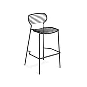 A minimalist black metal Apero Stacking Barstool with a wireframe design, crafted from e-coated steel for durability. It features a curved backrest and seat of horizontal bars, four slender legs, and a footrest—ideal as an outdoor barstool on a plain white background.
