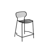 Minimalist black Apero Stacking Barstool with a curved backrest and seat, both featuring horizontal slats. This modern steel barstool has four slender legs with a footrest bar, perfect for outdoor use and set against a plain white background.