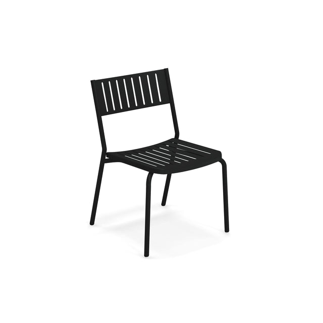 A black steel frame chair with a slatted backrest and seat, featuring straight legs and a minimalist, modern design. The Bridge Stacking Side Chair is angled slightly to the right and stands alone against a plain white background.