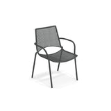 A black steel mesh chair with a minimalist, modern design, featuring gently curved armrests and four straight legs. This airy Topper Stacking Armchair is lightweight, making it perfect as an outdoor indoor chair for any space.