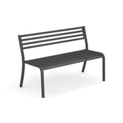 A simple, modern Segno Stacking Bench made of dark gray steel, featuring a slatted seat and backrest with three horizontal slats. This outdoor bench has four straight legs, no armrests, and is set against a plain white background.