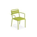 The Star Stacking Armchair is a green metal outdoor/indoor chair with armrests and steel slats on the seat and backrest. Featuring a modern, minimalist design, it stands on four straight legs against a plain white background.