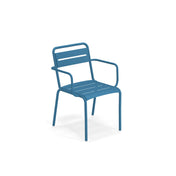 A modern blue metal Star Stacking Armchair with a slatted seat and backrest, made of e-coated steel for outdoor/indoor use. The minimalist design features simple, rounded armrests and legs against a plain white background.