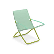 A modern outdoor lounge chair with a light green EMU-tex fabric mesh seat and backrest, thin armrests, and a tubular metal frame in a brighter green. The chair’s slanted, low-profile design casts a light shadow on a white background.