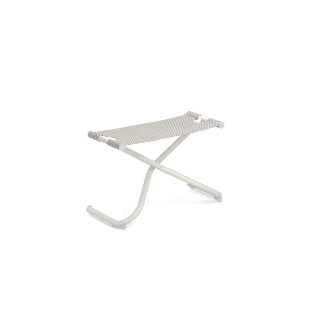 A minimalist, modern stool with a white metal frame and light beige striped EMU-Tex fabric seat. Inspired by the Snooze Ottoman, its X-shaped curved legs have rubber caps, and the seat is stretched taut. Perfect as an outdoor ottoman. Plain white background.