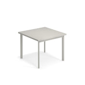 A simple, square, light gray outdoor table with four straight legs, shown against a plain white background. The table has a minimalist design with clean lines and no decorative features.