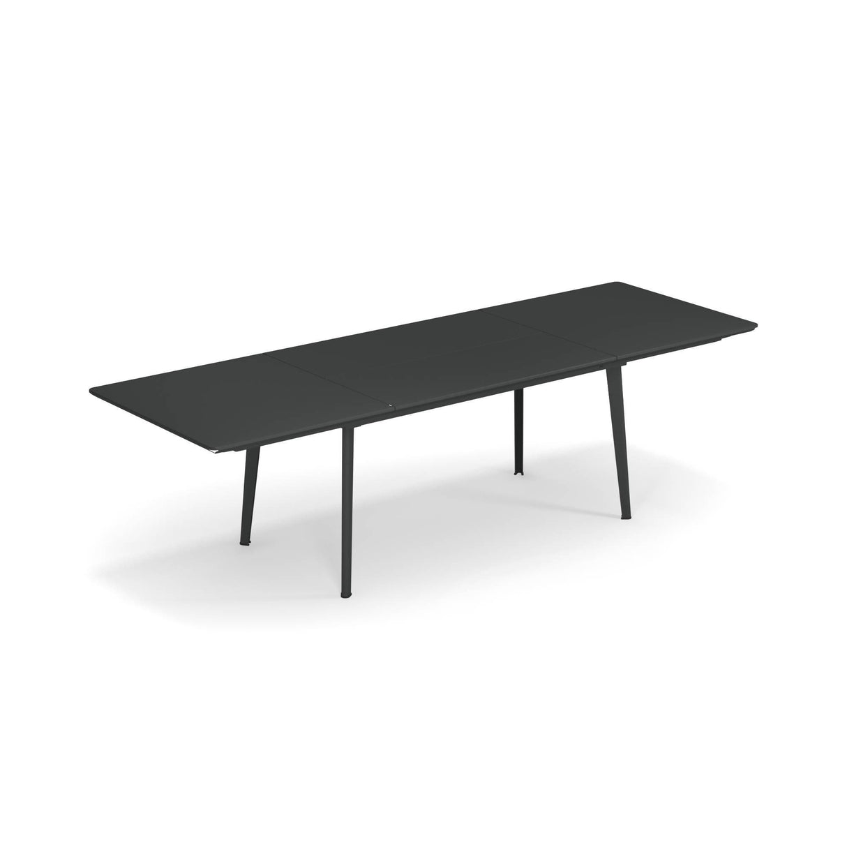 A long, modern Plus4 Extension Table with a matte black finish, slim solid steel top, and four angled legs. The extendable section in the middle allows for extra seating. The background is plain white.