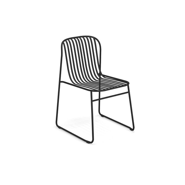 A modern wrought iron chair made of black metal rods forms the backrest, seat, and sled base legs, creating a minimalist, open design with curved lines. Ideal as an outdoor indoor chair, it features no armrests against a plain white background.