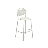 A modern white steel barstool with a rounded, slatted backrest and seat. Featuring four slender legs and a front footrest, this minimalistic, contemporary stacking barstool is perfect for both indoor and outdoor settings.
