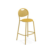 A modern yellow steel barstool with a rounded backrest and seat, both featuring curved cutout slats. The stacking barstool has four slender legs, a footrest bar, and a circular handle-like cutout at the top. Background is white.