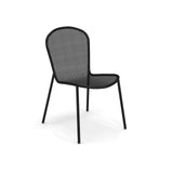 A modern black steel mesh chair with four slender legs and a rounded backrest. Perfect as an outdoor side chair, its seat and backrest feature a perforated pattern. The chair is photographed on a white background.