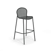 A modern black steel mesh barstool with a curved, perforated metal backrest and seat. This stacking barstool features four slender legs, a footrest, and a minimalist, airy design, perfect for both indoor and outdoor settings.
