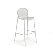 A minimalist, white steel mesh barstool with a rounded backrest, four slender legs, and a front footrest. Its simple, modern design features a slightly curved seat and clean lines, perfect as an indoor outdoor barstool against any backdrop.