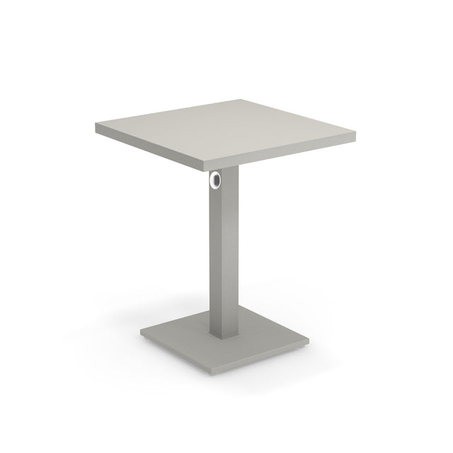 A modern square Lock Table with a light gray, flat tabletop. Crafted from e-coated steel, it features a central rectangular pedestal with a circular accent, and a flat square base. The minimalist design suits both outdoor/indoor spaces. Background is plain white.
