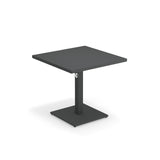 A modern, square, black Lock Table with a single central pedestal base and square metal support. The minimalistic design features clean lines, an e-coated powder coat finish, and is perfect for outdoor indoor settings against a plain white background.