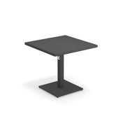 A modern, square, black Lock Table with a single central pedestal base and square metal support. The minimalistic design features clean lines, an e-coated powder coat finish, and is perfect for outdoor indoor settings against a plain white background.