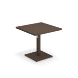 A modern square brown Lock Table with a flat top, supported by a single central pedestal and square base. Featuring an e-coated powder coat finish, its minimalist design has clean lines and a small circular detail on the central support. Plain white background.