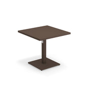 A modern square brown Lock Table with a flat top, supported by a single central pedestal and square base. Featuring an e-coated powder coat finish, its minimalist design has clean lines and a small circular detail on the central support. Plain white background.