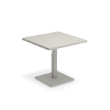 A modern, minimalist Lock Table with a light-colored tabletop. Suitable for outdoor/indoor use, it features a single central support column and a flat rectangular base, both in matching gray with an e-coated powder coat finish for durability.