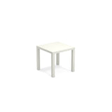 A small, square, white Star Table with four straight legs and a sleek steel top, shown against a plain white background. Its minimalist design suits both outdoor/indoor spaces, offering versatility without any extra features or decorations.
