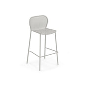 A modern, light gray steel mesh barstool with a curved mesh backrest and seat, four slender legs, and a horizontal footrest connecting the front two legs. The minimalistic, airy design is perfect as an outdoor barstool against a plain white background.