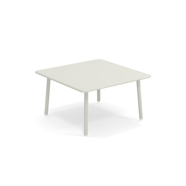 A small, square Darwin Low Table with a light-gray steel top and rounded edges sits on four cylindrical legs against a plain white background. Its minimalist design is perfect as an outdoor table for modern interiors or patios.