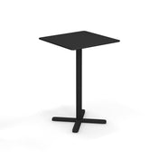 A modern, black Darwin Tilt Top Bar Table with a square top and single central leg, supported by a solid steel, cross-shaped base. Minimalist in design, this outdoor bar table is set against a plain white background.