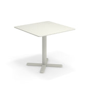 A simple square white Darwin Tilt Top Table with rounded corners, a single central pedestal leg, and a four-pronged base, all in matching white solid steel, perfect as an outdoor/indoor table set against a plain white background.