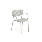 A light gray Mom Stacking Armchair, crafted from solid steel, with four legs, gently curved armrests, and a slatted backrest and seat. The simple, modern outdoor chair is shown against a plain white background.