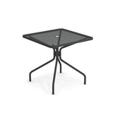 The Cambi Table features a black square metal frame with a mesh top, rounded corners, and a central umbrella hole. Its four curved legs provide sturdy support, making this simple, modern table perfect for outdoor/indoor use.