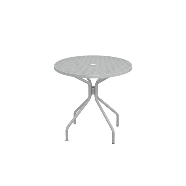 A round, light gray Cambi Table with a mesh top and a central hole, supported by four angled legs connected by a central brace. The simple, modern design makes this outdoor table ideal for patios. The background is plain white.