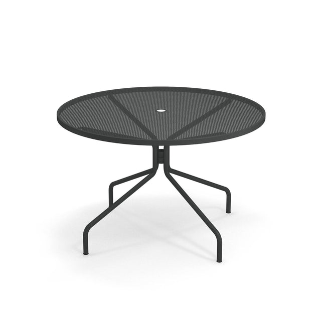 A round, black Cambi Table with a mesh top and a central hole for an umbrella. This outdoor table features slender, angled legs that branch out for stability, casting soft shadows on a white background.