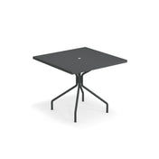 A black, square solid steel table with a thin tabletop and central hole, supported by four slender, angled legs connected at the center—made in Italy and suitable for both outdoor and indoor use, shown against a plain white background.