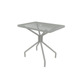 A small, square outdoor/indoor table with a glass top and central hole, supported by a gray metal frame with four angled legs that curve outward. The minimalist, modern Cambi Table blends style and function for any space.