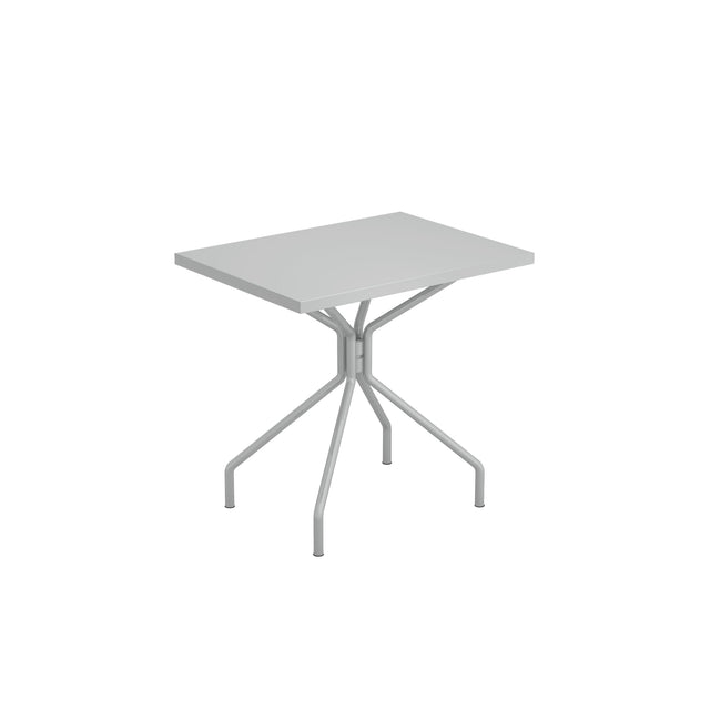 A modern, rectangular gray indoor outdoor table with a flat top and four angled legs that join at the center beneath the tabletop, creating a sturdy, minimalist design. The background is plain white.