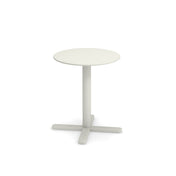 A small, round, white Darwin Tilt Top Table with a single central pedestal base branching into four flat feet, set against a plain white background. This minimalist, modern outdoor indoor table is perfect for versatile spaces.