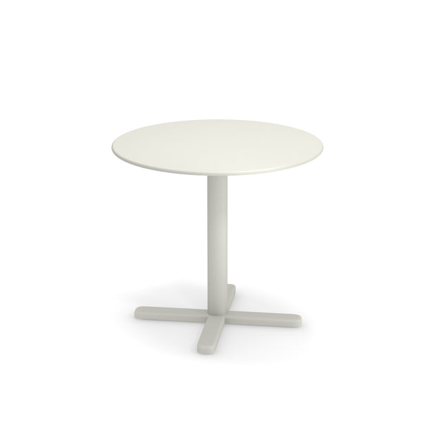 A small, round white steel dining table with a simple design, featuring a smooth tabletop, a single central cylindrical pedestal, and a four-pronged base. The background is plain white.