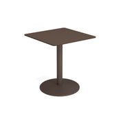 A small, modern bistro table with a flat brown tabletop, a single central steel pedestal, and a round flat base. Its minimalistic design features smooth edges, perfect for both outdoor and indoor settings against a plain white background.