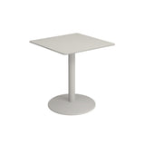 A simple, modern bistro table with a flat, light gray top and a single central steel pedestal base stands on a round, flat base. Perfect as an outdoor indoor table, it is photographed against a plain white background.