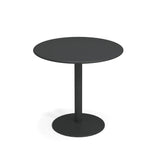 A plain, round black bistro table with a flat top, a single central steel pedestal, and a circular base. The minimalistic, modern design suits both outdoor and indoor spaces, shown here against a white background.