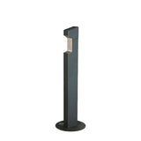 A modern, black metal outdoor bollard light with a rectangular top, standing on a circular base. Inspired by hands free designs like Foot Pump operated Hand Sanitizer Dispensers, its recessed light under the angled head creates a sleek, minimalist look.