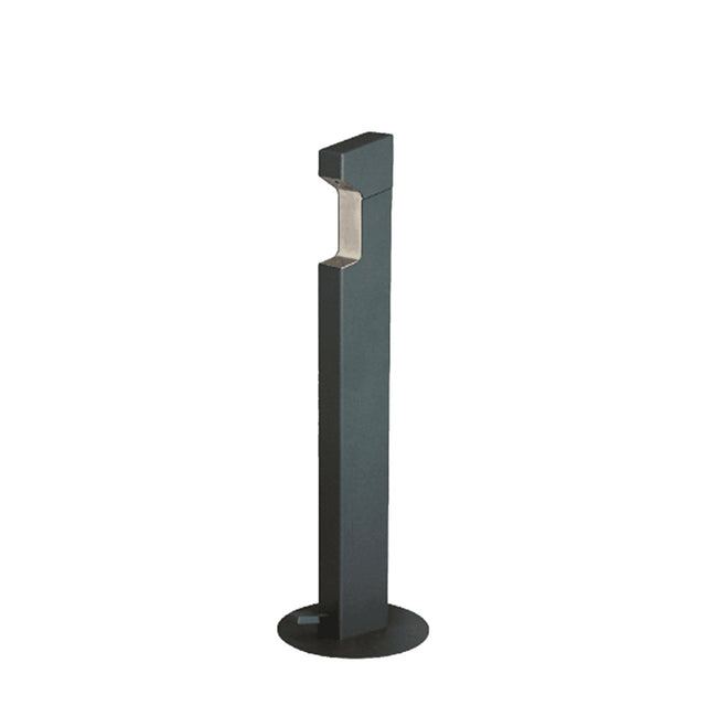 A modern, black metal outdoor bollard light with a rectangular top, standing on a circular base. Inspired by hands free designs like Foot Pump operated Hand Sanitizer Dispensers, its recessed light under the angled head creates a sleek, minimalist look.