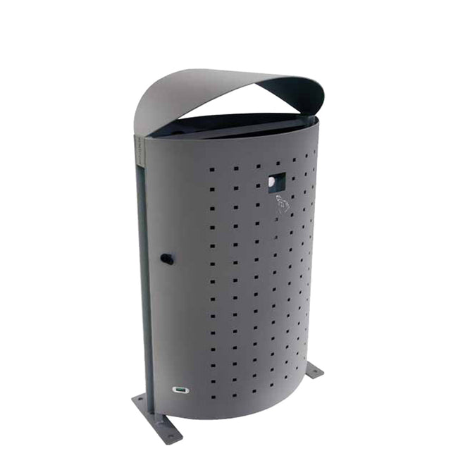 A modern, cylindrical outdoor litter bin in dark gray features a perforated pattern, a slanted top cover, and is mounted to the ground with two flat metal feet. The bin includes a small icon of a person throwing trash.